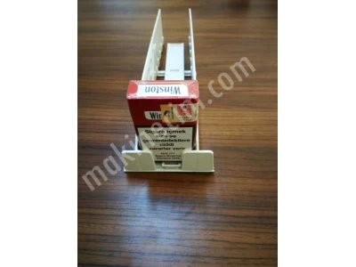 Cigarette shelf pusher. cigarette rack