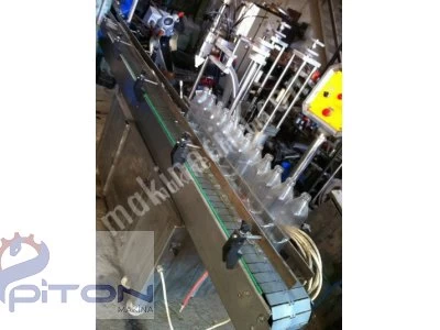 LIQUID OIL AUTOMATIC FILLING MACHINE WITH 4 NOZZLES WITH AUTOMATIC CONVEYOR SYSTEM